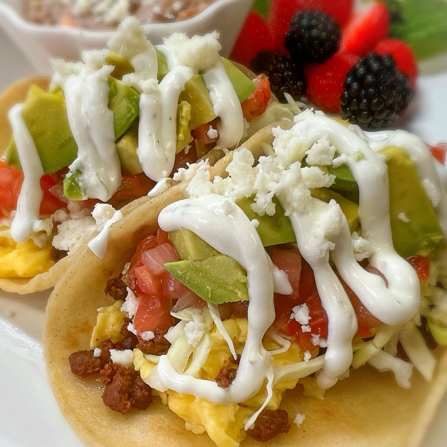 Chorizo and egg breakfast tacos with avocado, pico de gallo, queso fresco and crema