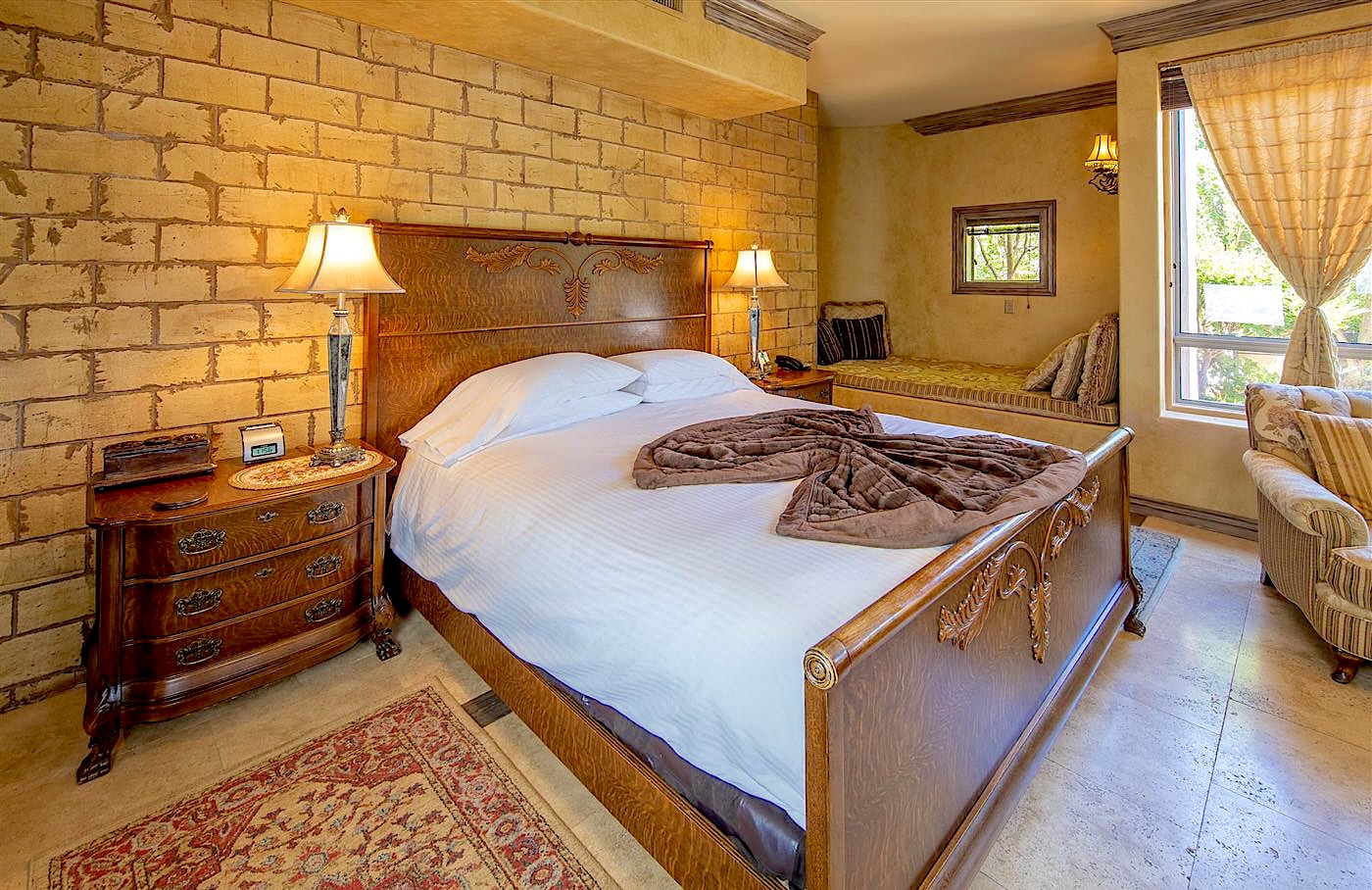 Antiquities villa bed with vintage furnishings at Adobe Grand Villas in Sedona