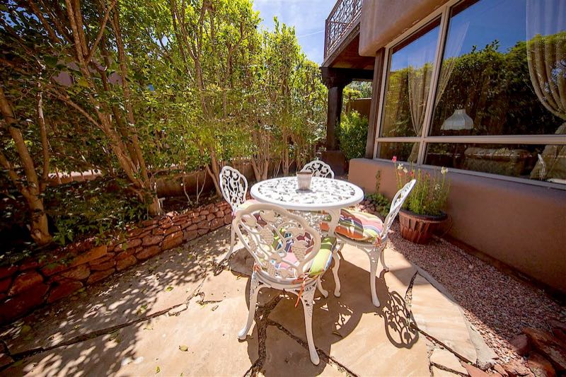 Antiquities villa private garden patio with a wrought-iron table