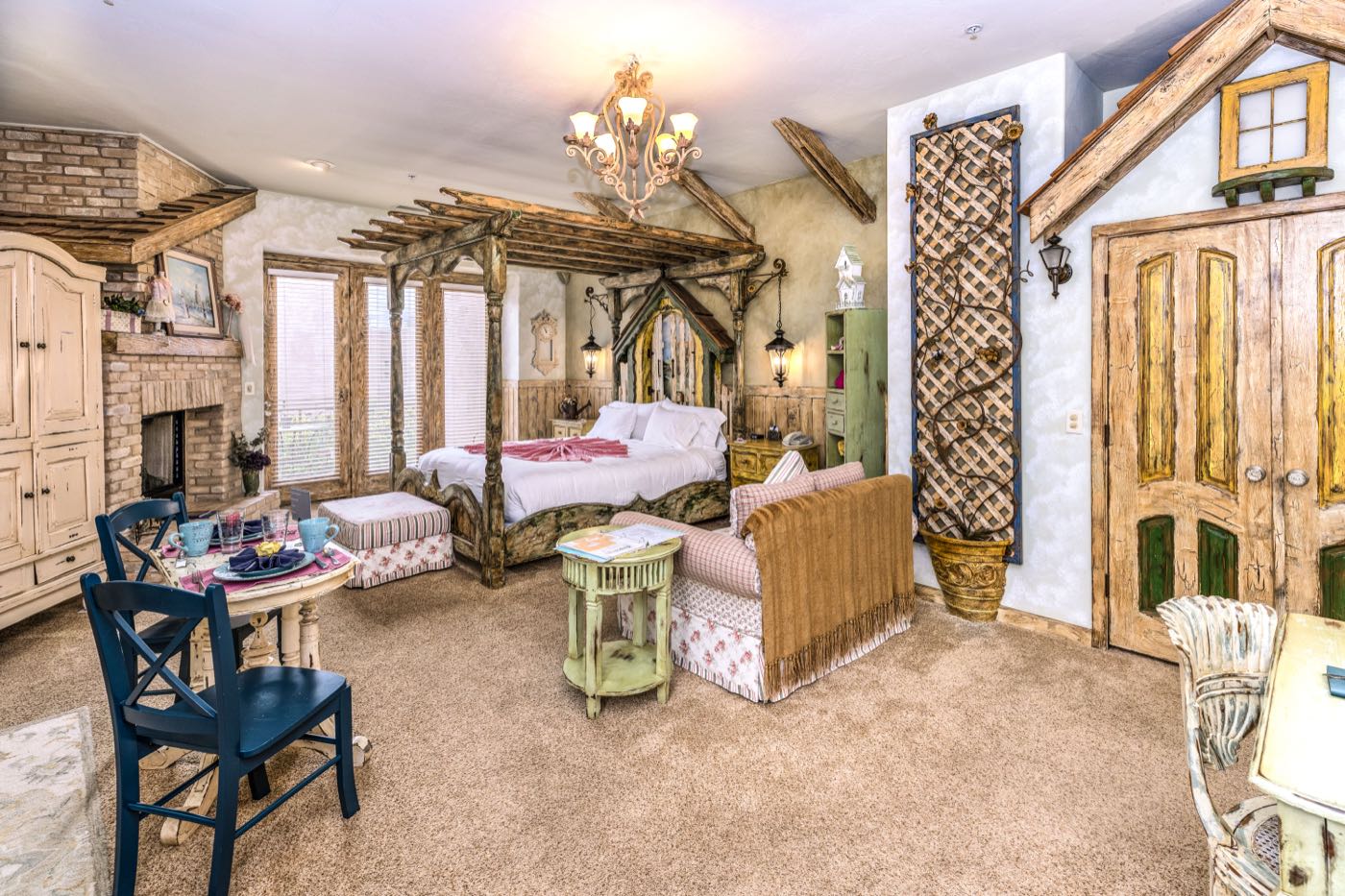 Country Garden villa bedroom with a dining table and fireplace