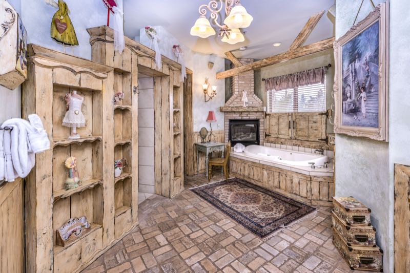 Country Garden villa jetted tub framed in rustic wood