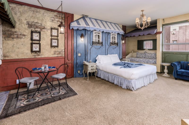 French Quarter villa bedroom with a bistro table