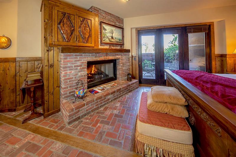Red Cinder villa brick fireplace and patio doors
