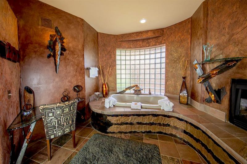 Visions villa jetted tub below a glass-block window
