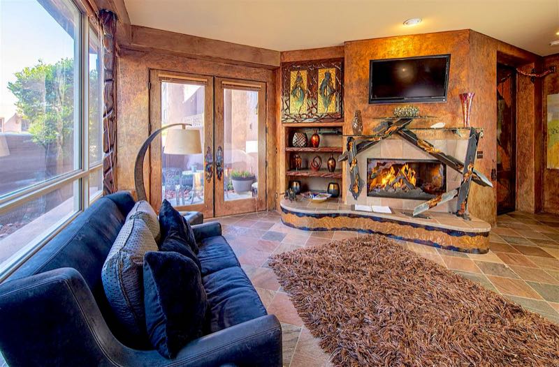 Visions villa sitting area facing the fireplace