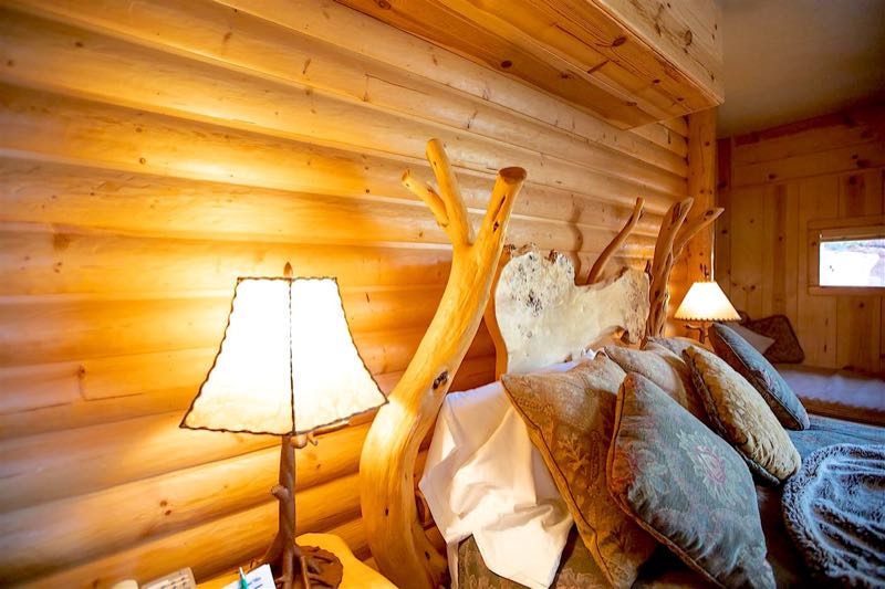 Whispering Pine villa handcrafted log bed